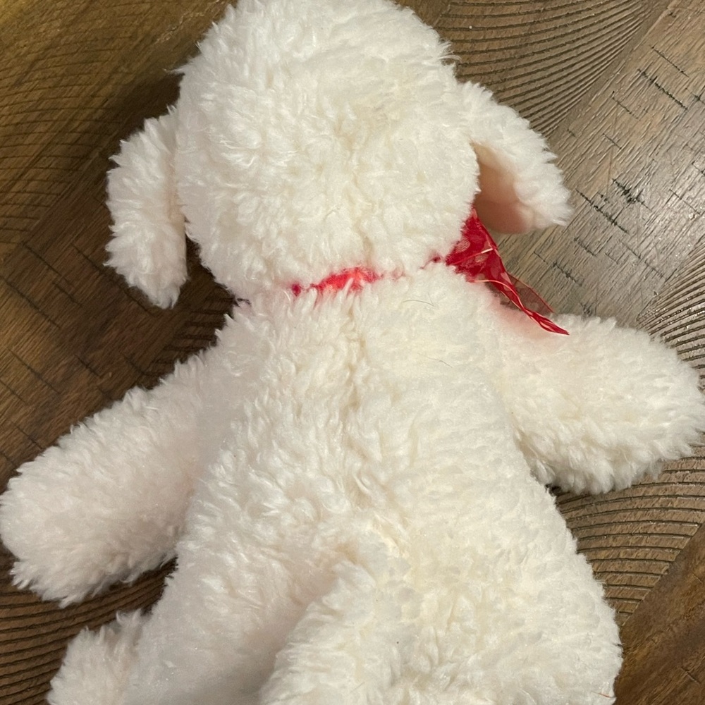 White Dog with Red Heart Bow
